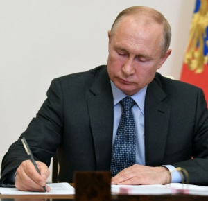 Putin signs bill allowing him 2 more presidential terms
